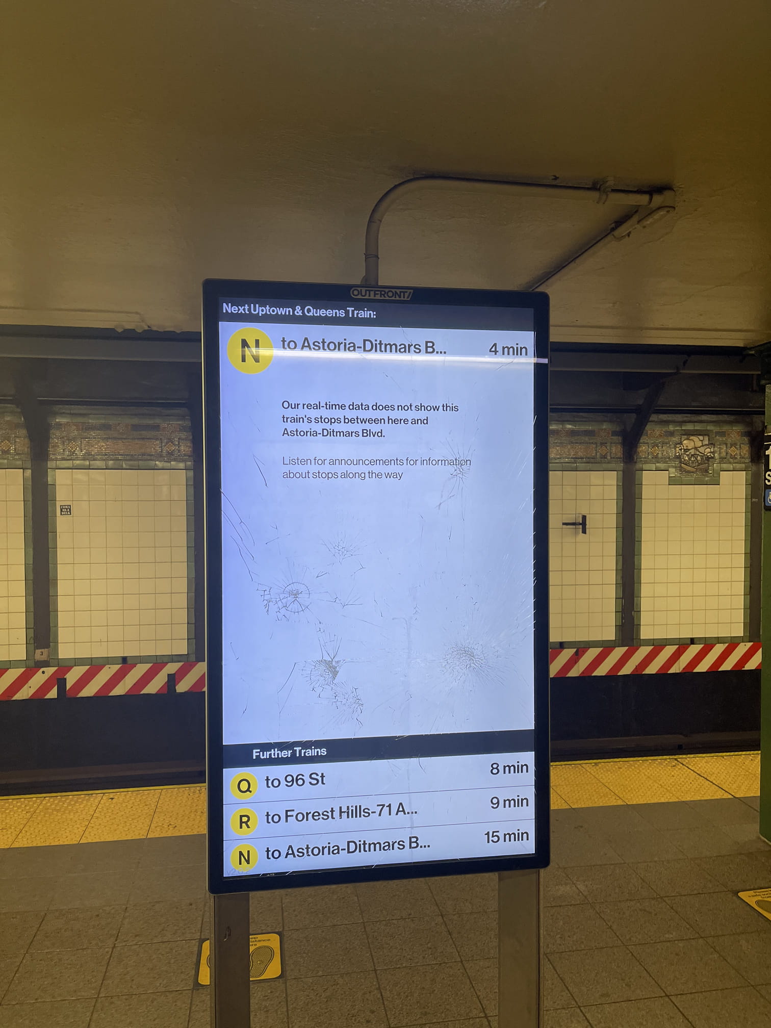 Partially smashed computer screen relaying train arrival information