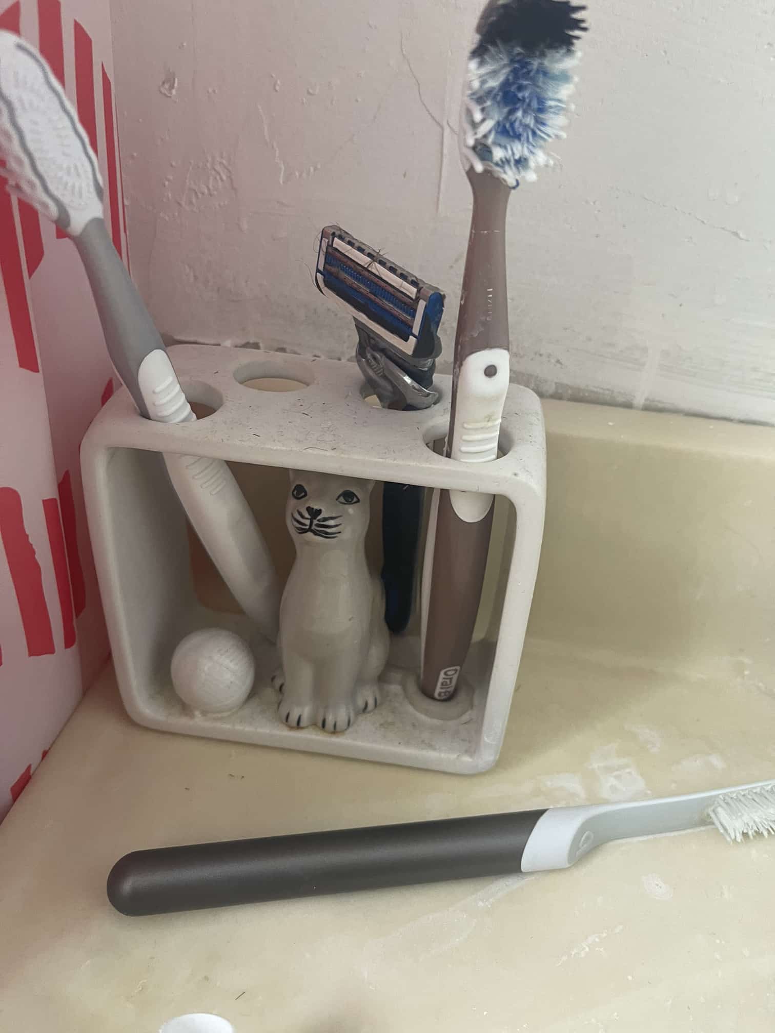 Seal holder for brushes and bathroom accessories