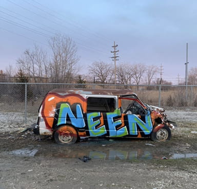 Neen tag on a destroyed old van