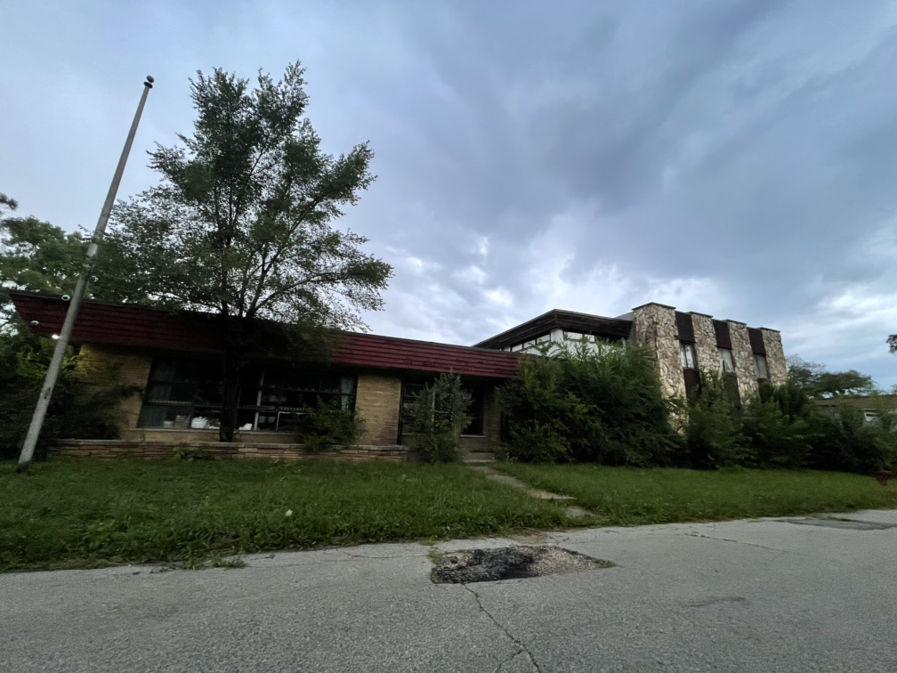 Beautiful but overgrown resource center building