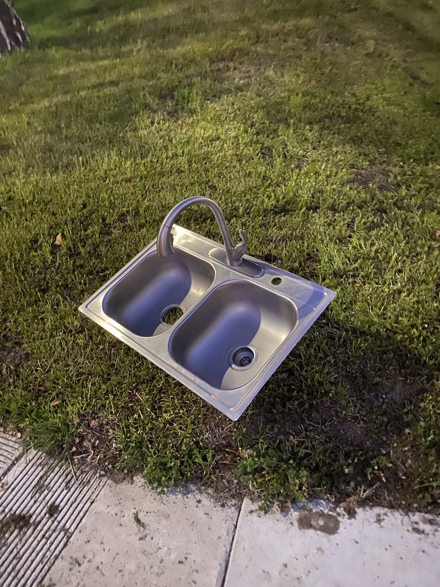 Kitchen sink on grass