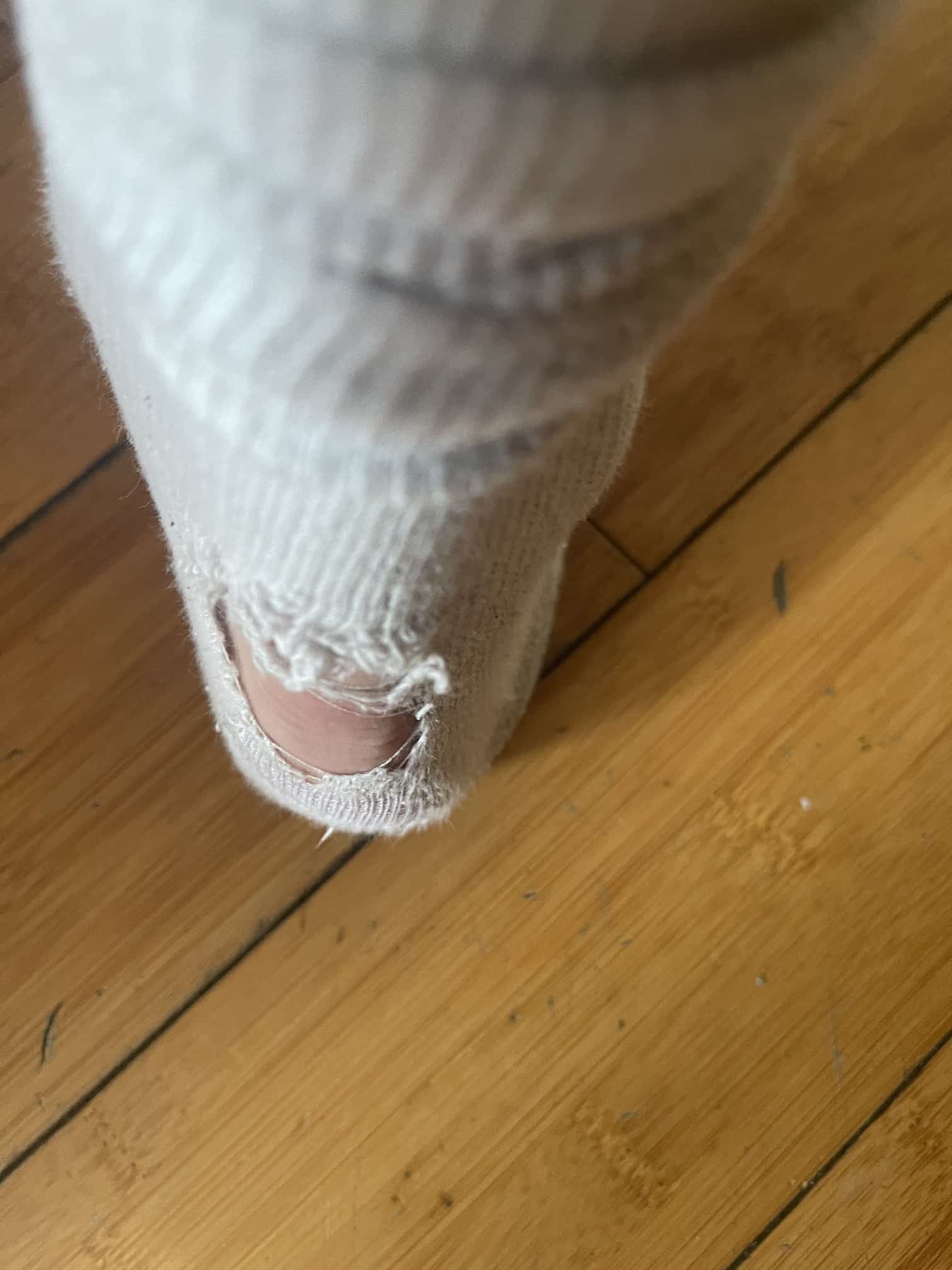 Close up of a hole in my sock