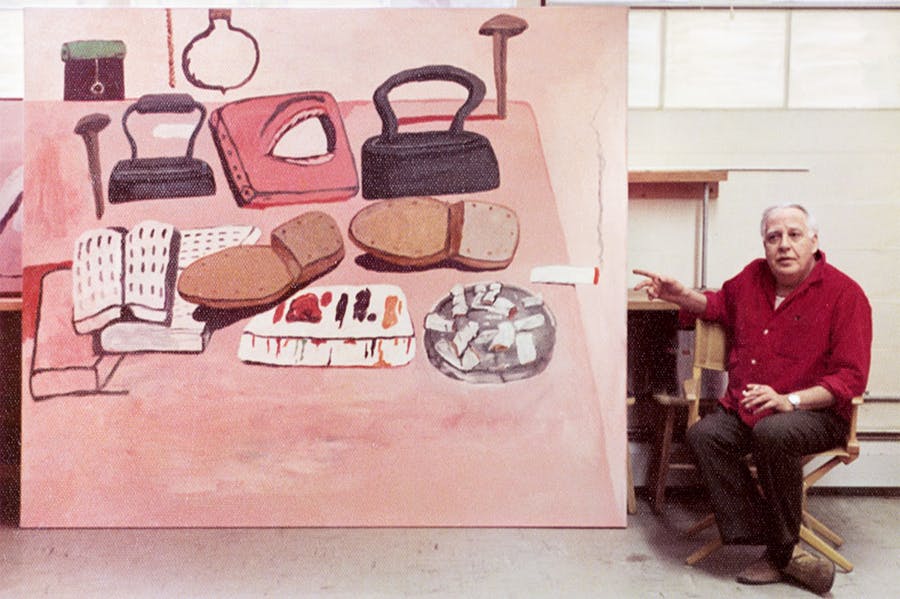 Philip guston next to one of his paintings